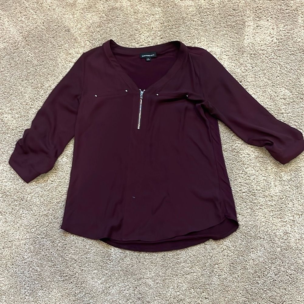 Woman’s blouse, cranberry color has zipper in the front silver accent